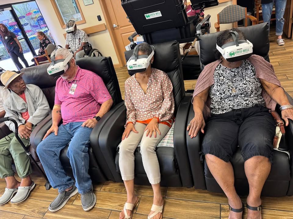 Participants relaxing in massage recliners at SarahCare Adult Day Care