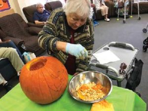 Dottie with pumpkin at adult day care