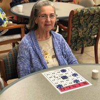 Marta playing bingo at adult day care